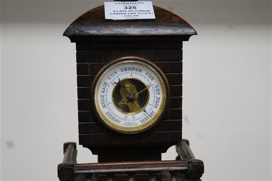 A late Victorian carved oak Lighthouse  clock barometer by Frank Flower of St James